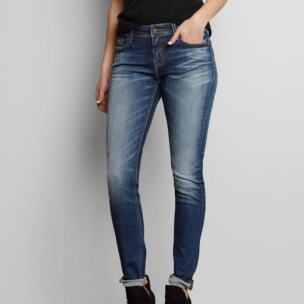 Buckle black skinny jeans.